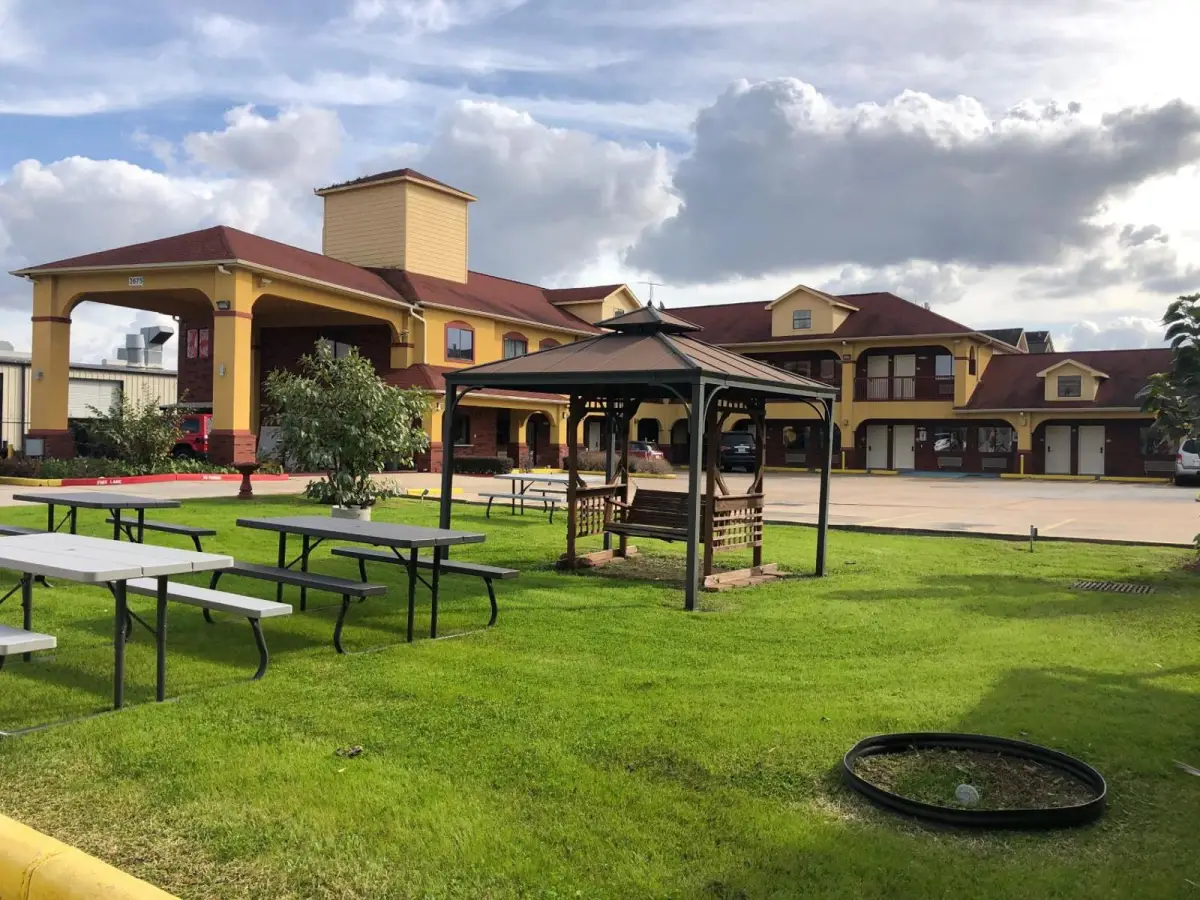 A large building with a grassy area in front of it